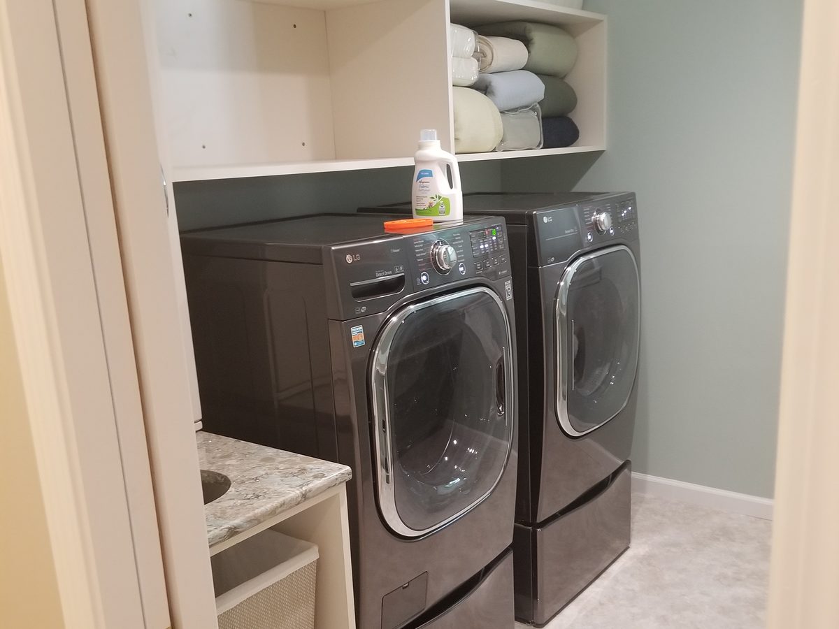 Finished laundry room with washer and dryer