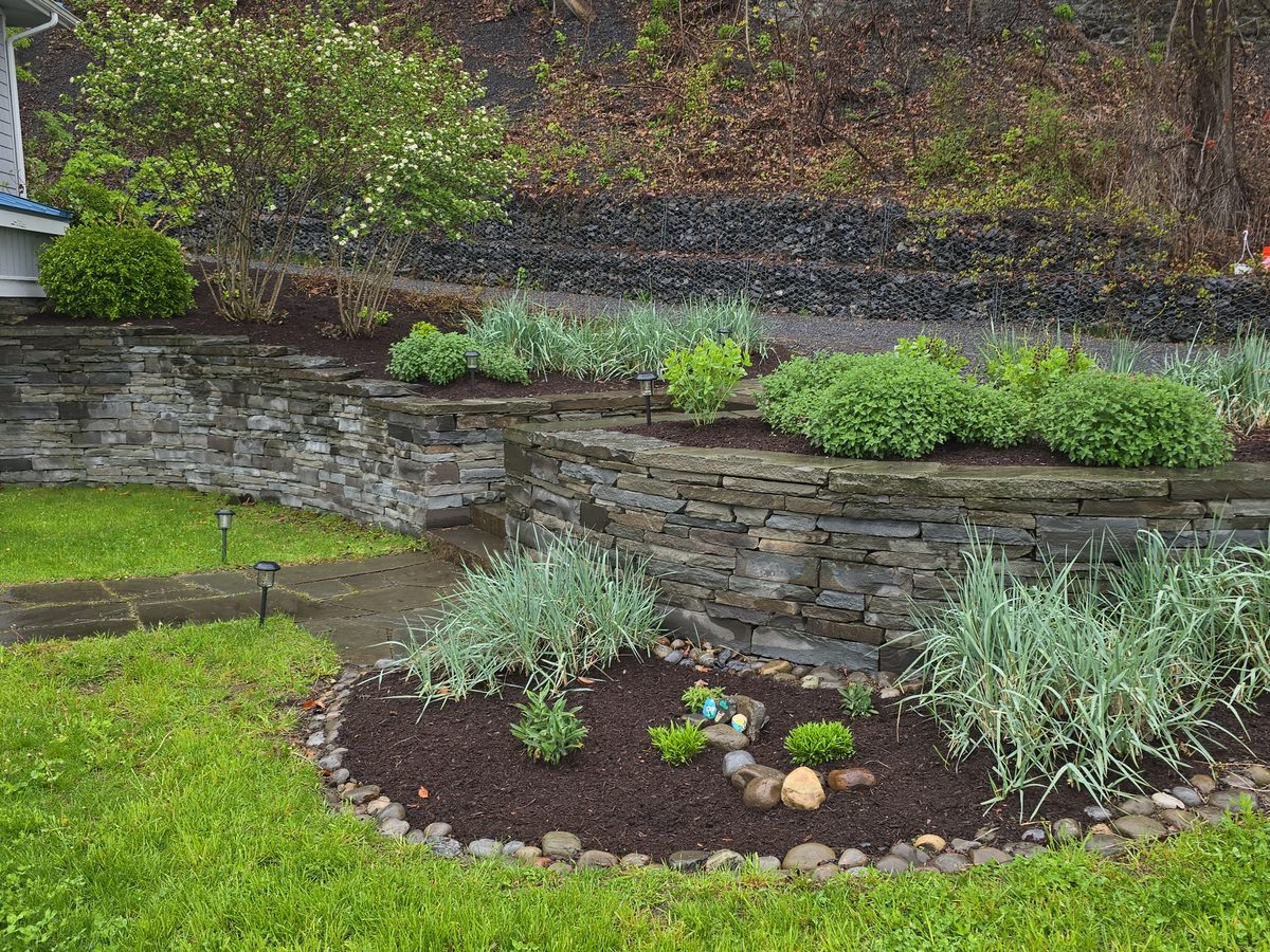 Terraced dry stone walls and planted beds
