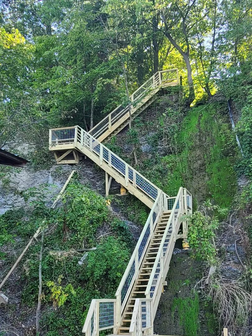 The finished staircase with wire mesh infill railings