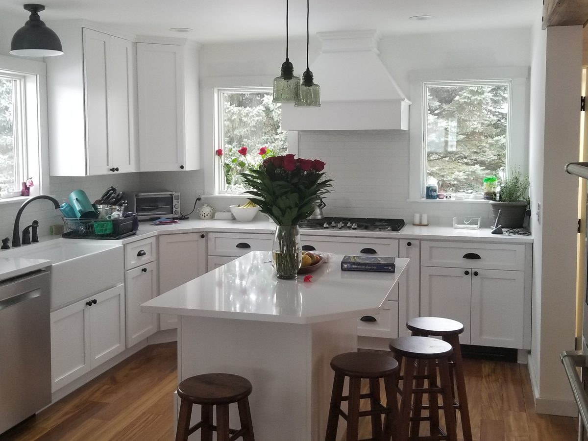 Finished kitchen wide view with island seating