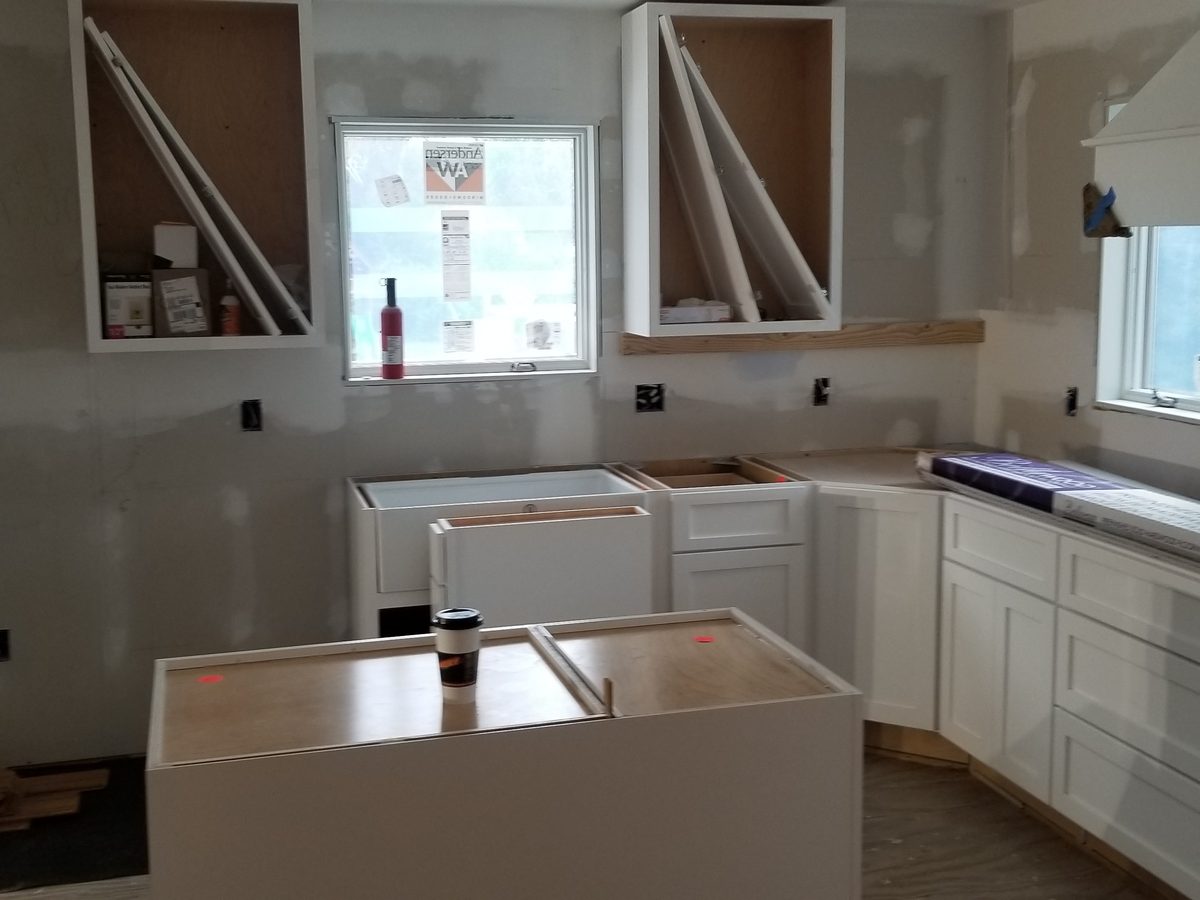 Finished built-in double oven wall with cabinetry