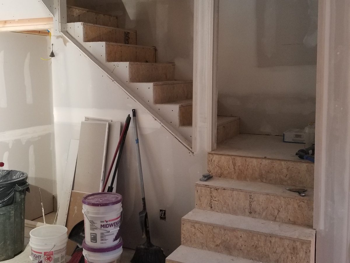 The same staircase at drywall stage